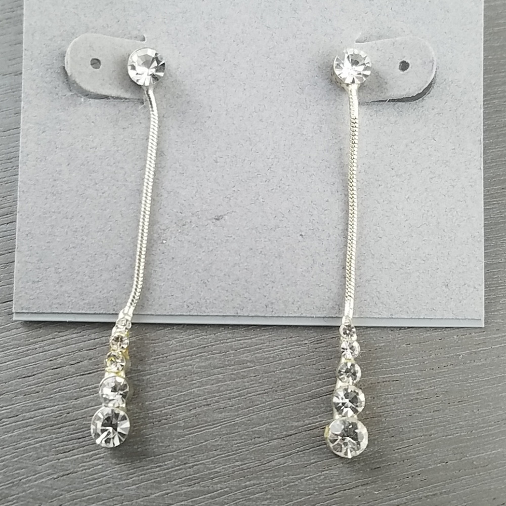 Dangling, shiny earrings